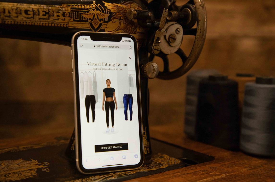 Image of an iPhone featuring 1822 Denim's virtual "Fit & Try" fitting room